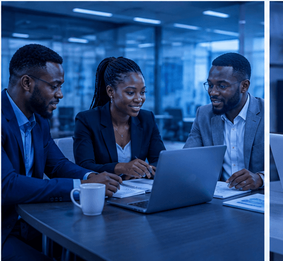 Three professionals reviewing a plan together on a laptop in a consulting meeting